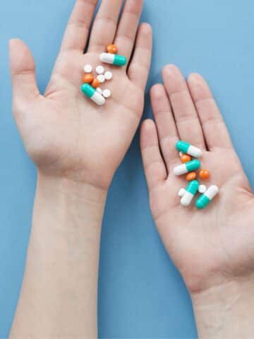 Hands holding a variety of probiotics with the text "the best probiotics for ADHD."
