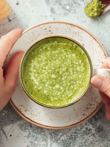 A cup of matcha green tea, a natural source of L-Theanine.
