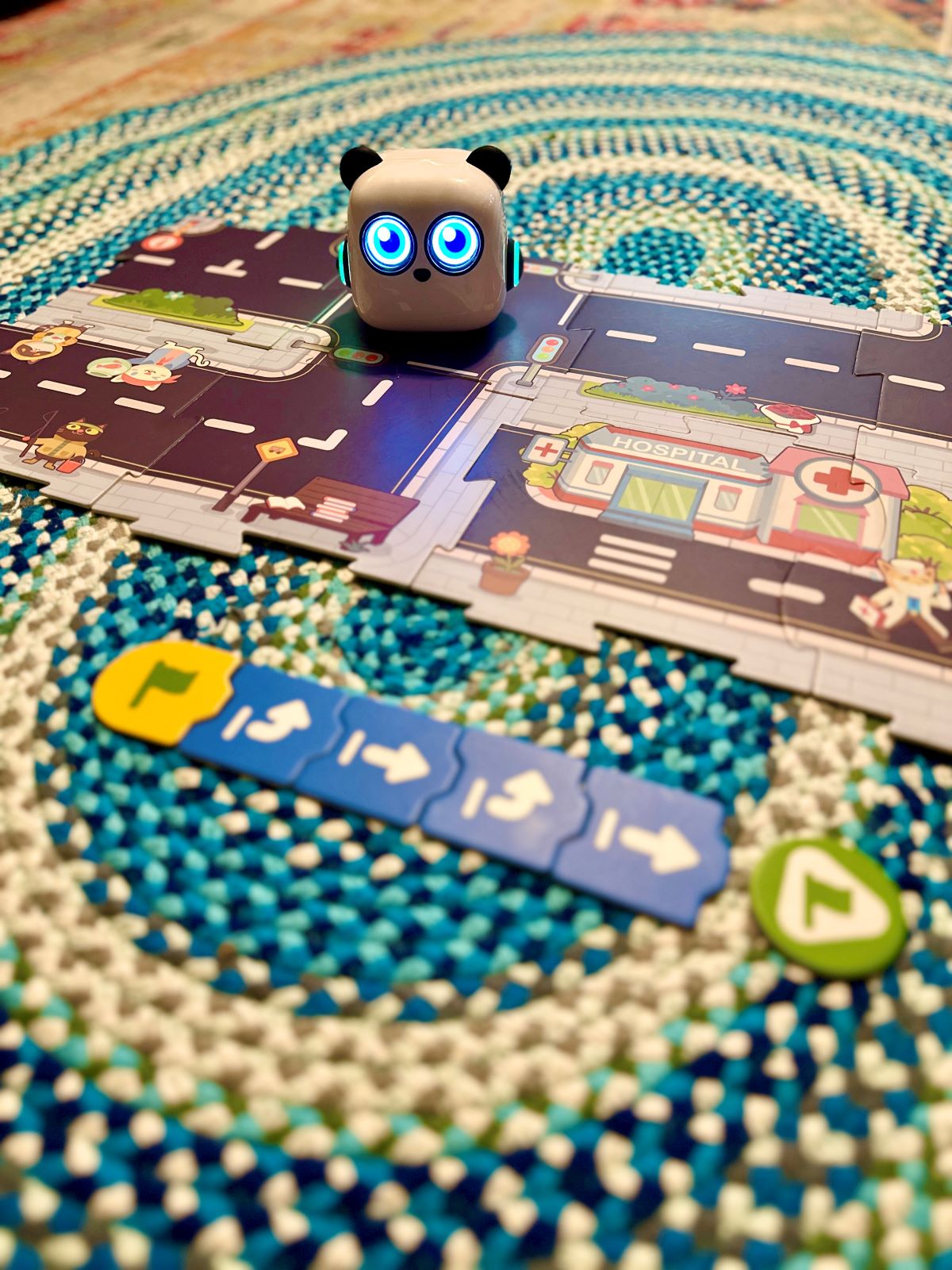 The mTiny robot toy on the road puzzle pieces.
