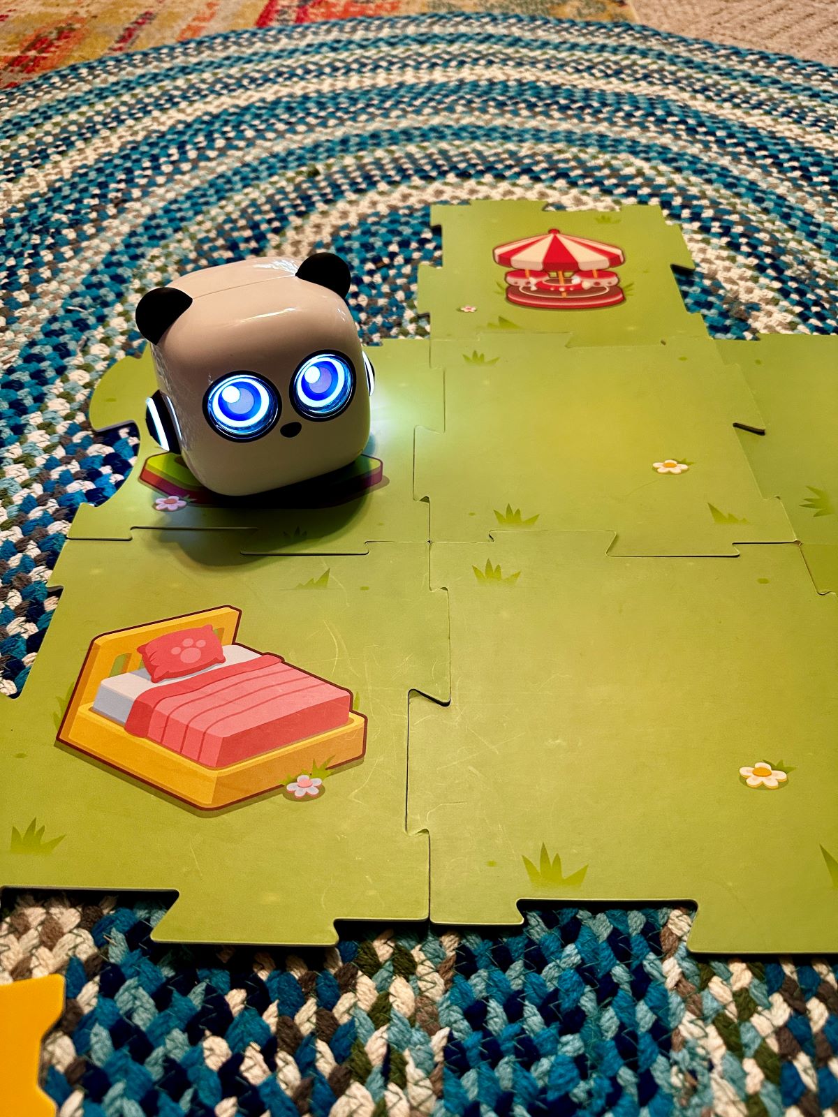 The mtiny coding toy on the play board.