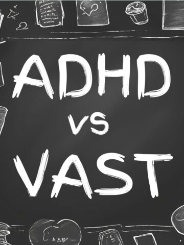 A chalkboard with ADHD vs VAST written on it, and doodles on the sides.