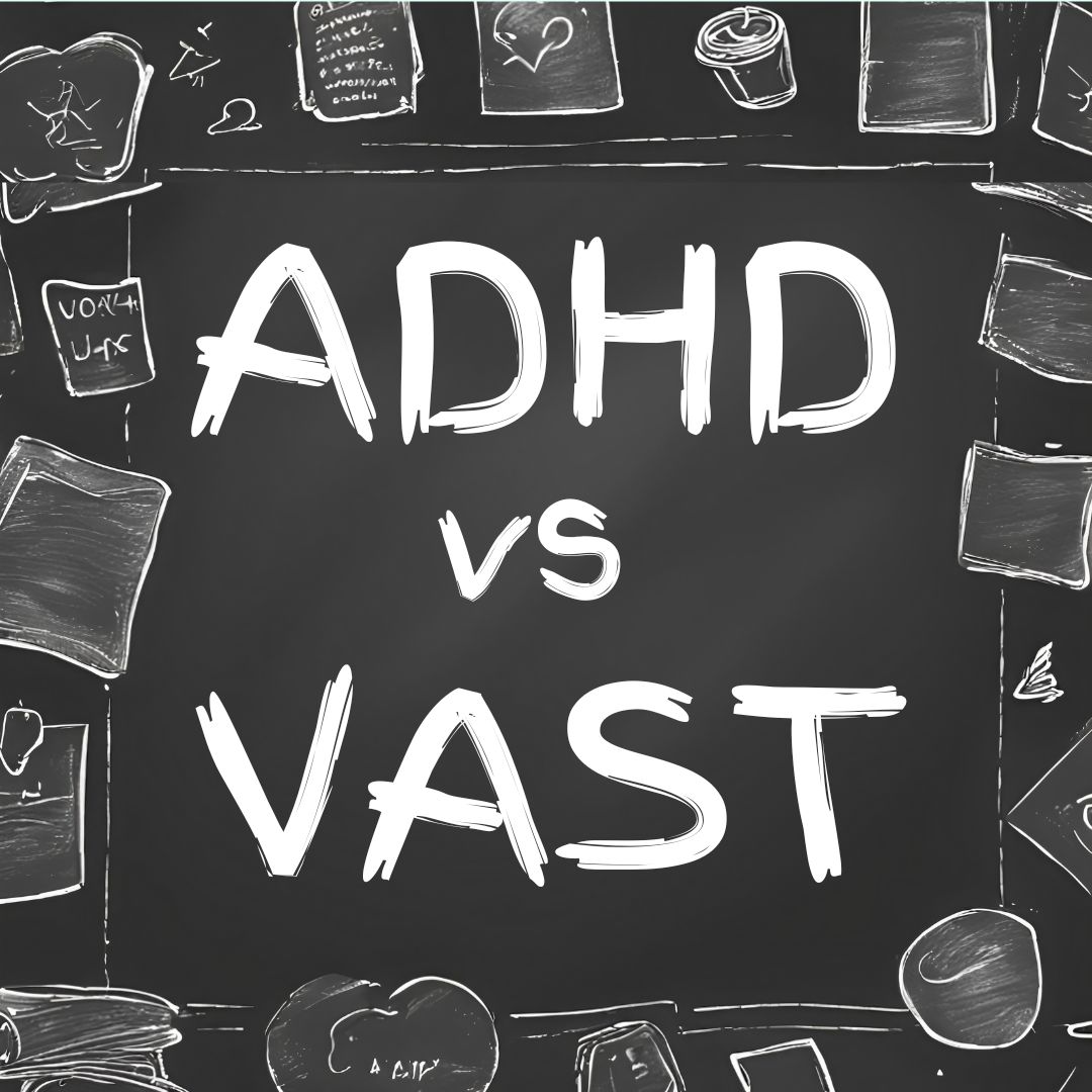 A chalkboard with ADHD vs VAST written on it, and doodles on the sides.